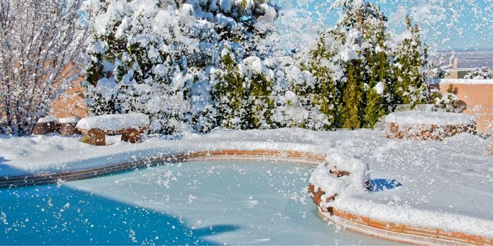 pool with snow falling